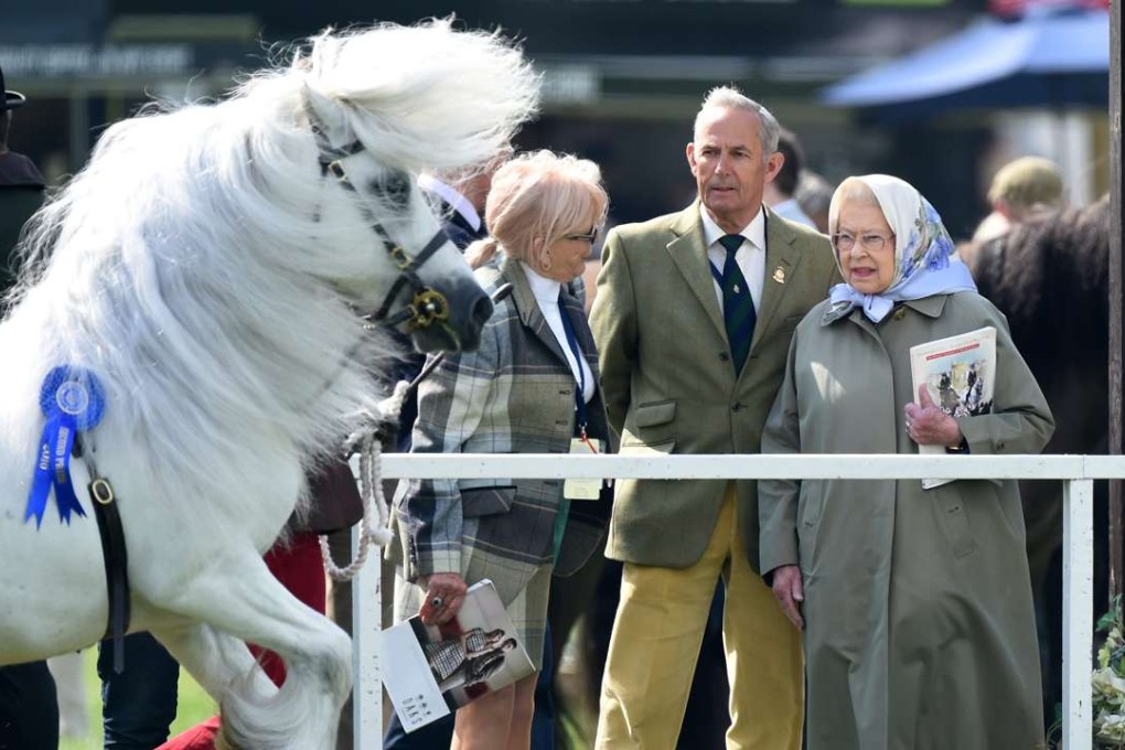 Britain's Queen Elizabeth (right) watches the Windsor Royal Horse Show on Sunday. Photo: EPA