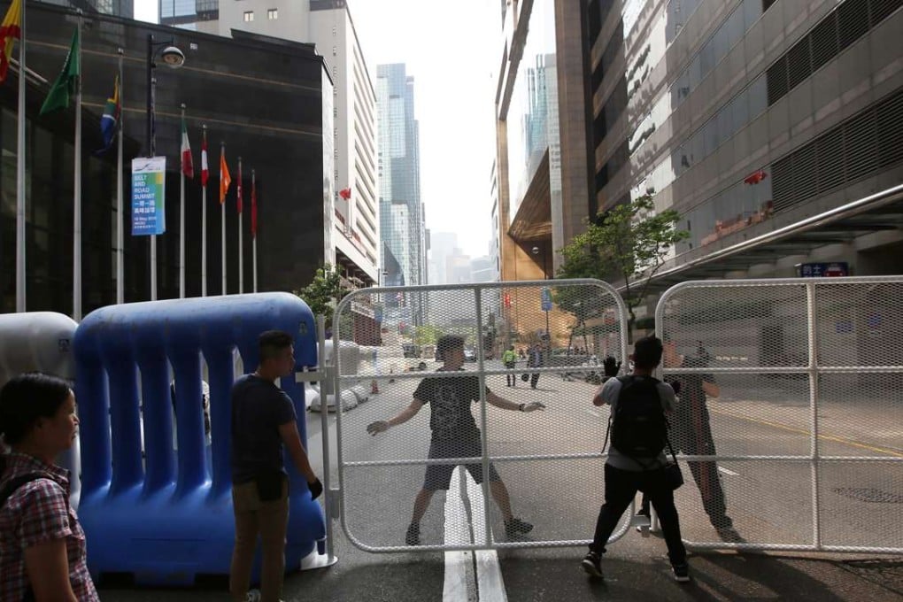 Mills barriers and water barriers have been places around the neighbourhood of the Grand Hyatt Hotel and the Convention and Exhibition Centre to cordon off restricted zones, for the National People’s Congress Standing Committee chairman’s three-day visit. Photo: Sam Tsang
