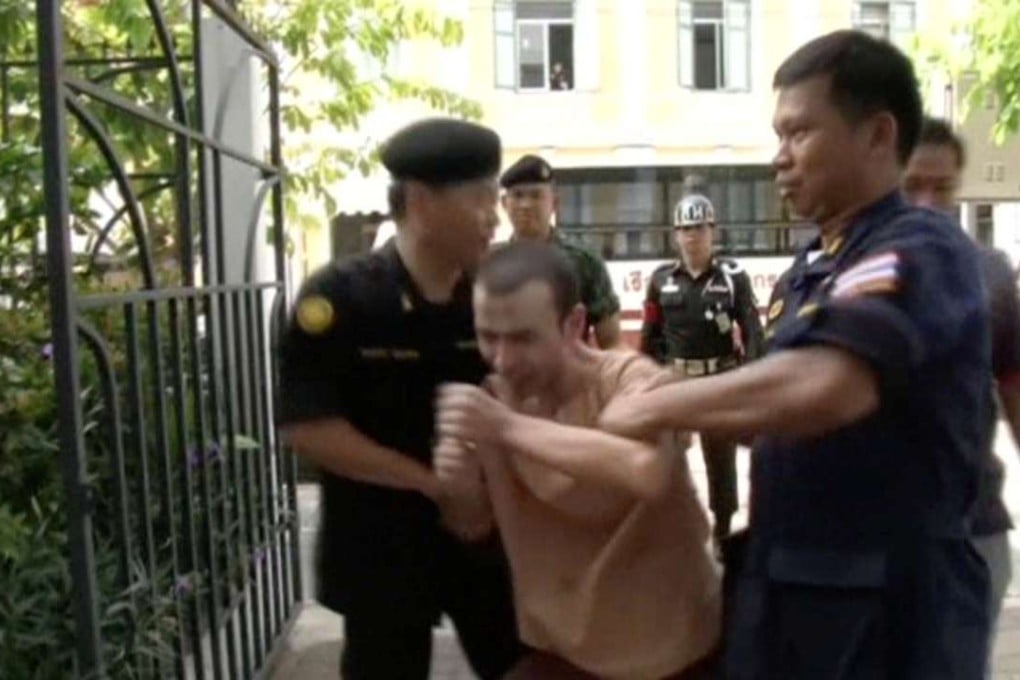 Still image taken from video shows Adem Karadag, also known as Bilal Mohammed, a suspect in last year's Bangkok blast, shouting as he is escorted to court in Bangkok, Thailand, May 17, 2016. REUTERS TV via Reuters ATTENTION EDITORS - FOR EDITORIAL USE ONLY. THIS IMAGE HAS BEEN SUPPLIED BY A THIRD PARTY. IT IS DISTRIBUTED, EXACTLY AS RECEIVED BY REUTERS, AS A SERVICE TO CLIENTS.