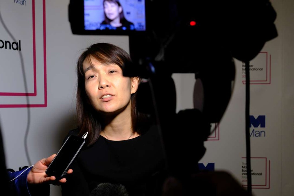 Winner of the 2016 Man Booker International prize for fiction Han Kang speaks to the media after the award ceremony in London on Tuesday. Photo: AP