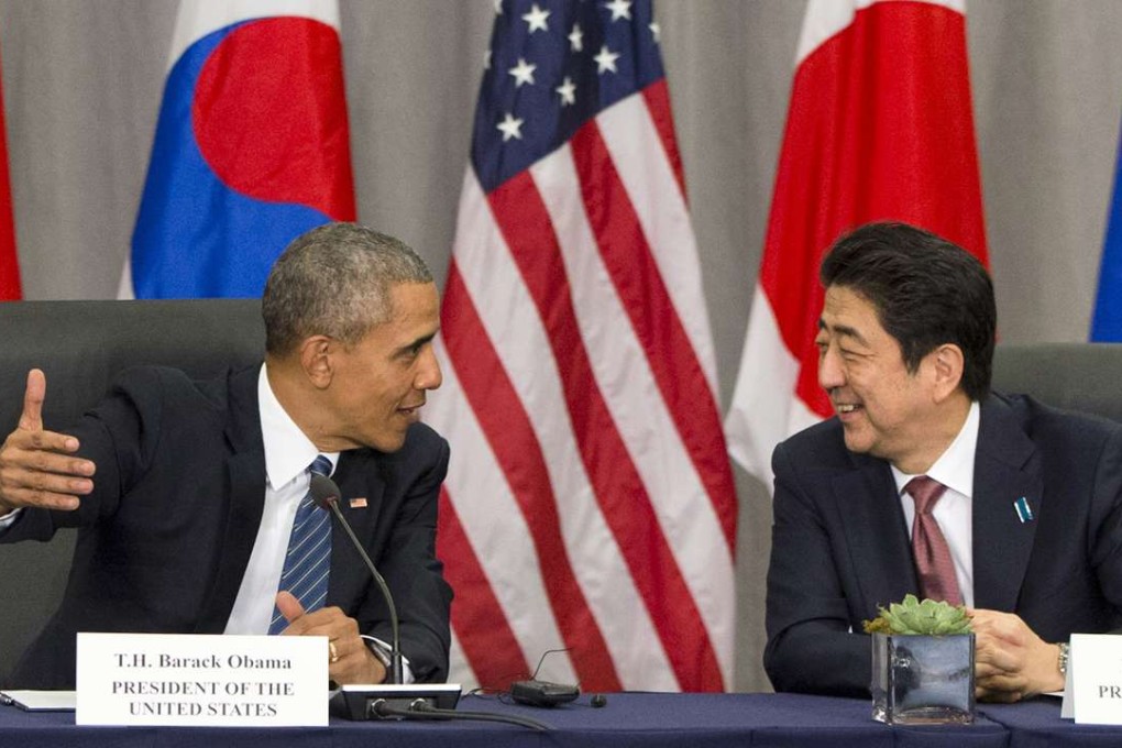 US President Barack Obama speaks with Japanese Prime Minister Shinzo Abe during their meeting at the Nuclear Security Summit in Washington. Photo: AP