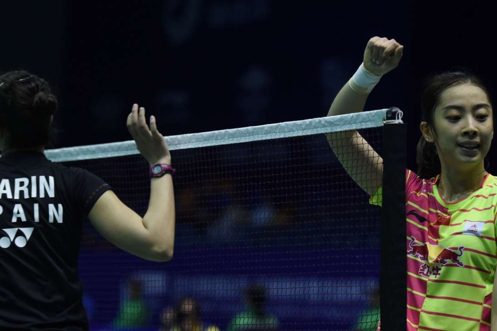 Wang Shixian of China and Carolina Marin of Spain shake hands after their women’s singles group match in the Uber Cup. Wang surprised the world number one by beating her after 90 minutes. Photo: AFP
