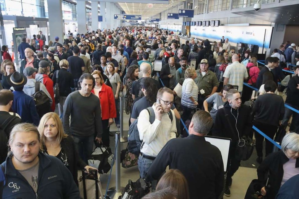 Passengers at O'Hare International Airport in Chicago queue to be screened at a security checkpoint on Monday. Photo: AFP