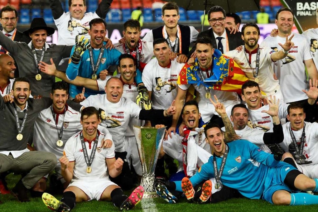 Sevilla celebrate with the trophy after winning the Uefa Europa League final. Photo: Reuters