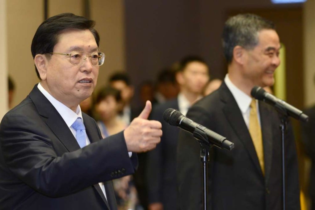Senior state official Zhang Dejiang (left) was accompanied by Chief Executive Leung Chun-ying (right) at the Central Government Offices. Photo: SCMP Pictures
