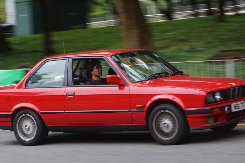 Carl Yuen in his BMW