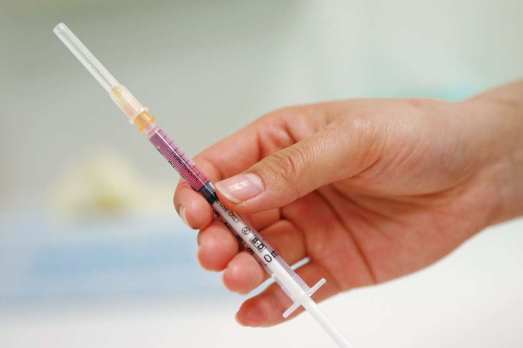 A nurse prepares a vaccine to be given to a child in a hospital in Beijing, China, April 13, 2016. REUTERS/Damir Sagolj
