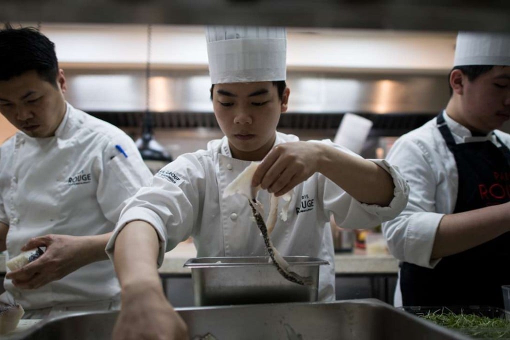 Chefs at work in a French restaurant kitchen in Shanghai. The first Michelin guide to the city’s restaurants will be published this year. Photo: AFP