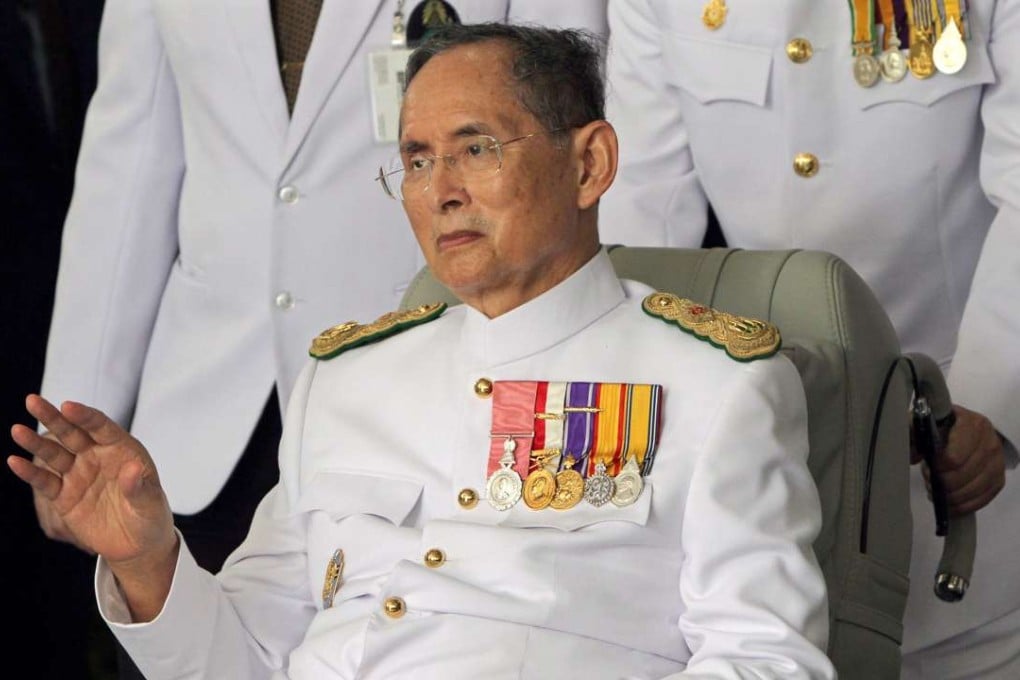Thai King Bhumibol Adulyadej waves to well-wishers. Photo: EPA