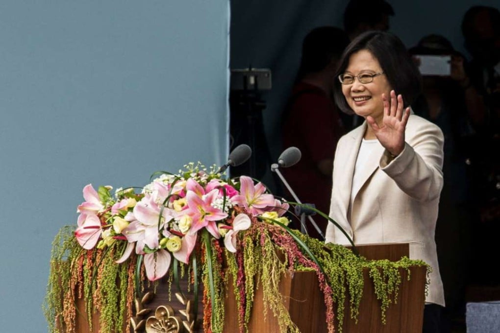 Tsai Ing-wen, Taiwan’s incoming president, waves during her inauguration ceremony at the Presidential Palace in Taipei, Taiwan, on Friday. Tsai said she will seek peaceful ties with Beijing while resisting pressure to acknowledge the idea that they are part of a single nation. Photo: Bloomber