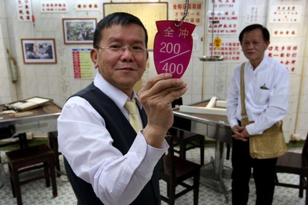 Lun Chi-keung, 58, and Ko Tat-kwan, 60, employees at Tai Choy Lee mahjong parlour on Kam Wing Street in San Po Kong. Photo: Nora Tam