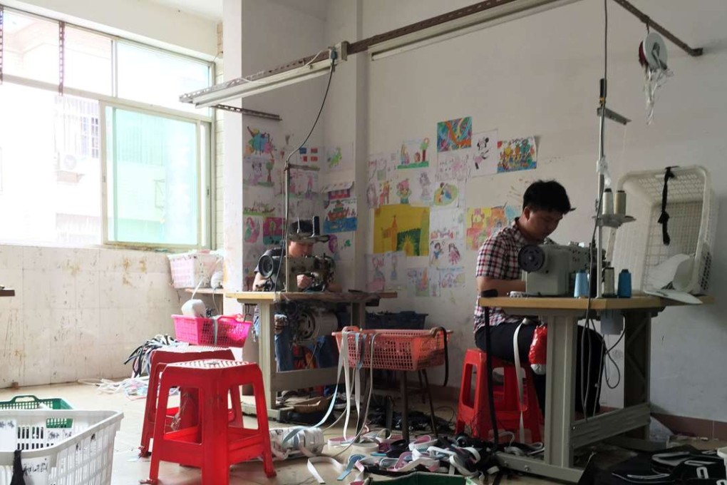Workers produce bags at a small factory in Huadu, Guangdong province. Photo: Reuters
