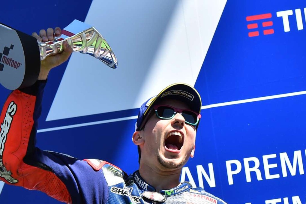 Moto GP Spanish rider Jorge Lorenzo celebrates on the podium after winning the Italian Grand Prix. Photo: AFP