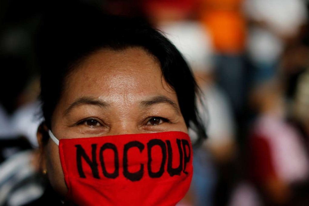 An anti-coup demonstrator takes part in a march in Bangkok as Thailand marks two years since the army toppled the elected government of former Prime Minister Yingluck Shinawatra. Photo: Reuters