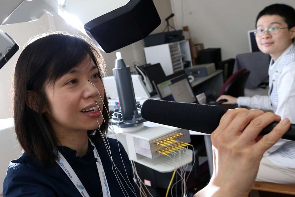 Karen Yu Ka-man demonstrates the Articulograph, a device used by speech therapists. Photo: Dickson Lee