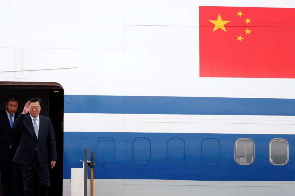 Zhang Dejiang steps off his Air China plane at the start of a three-day visit in Hong Kong in May. Photo: Reuters