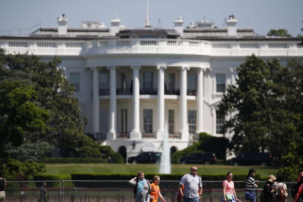 Tourist visit the White House in Washington, DC, last week. Security lockdowns at the executive mansion are a common event. Photo: EPA