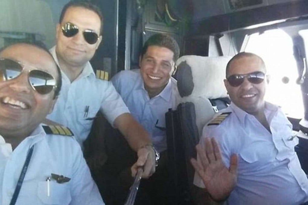 Mohamed Saeed Shokair (right), captain of downed EgyptAir Flight 804, poses with fellow EgyptAir crew in a photo posted to social media. Photo: Facebook