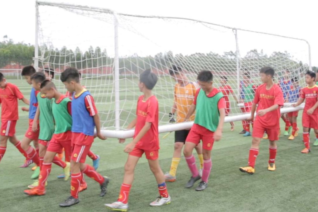 Students of Evergrande Football School in Qingyuan attend a training session. The academy is one of the largest youth training facilities in the world. Photo: Thomas Yau