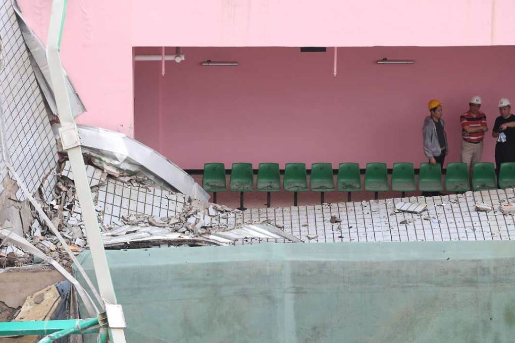 Building Department staff investigate the collapse. Photo: Sam Tsang