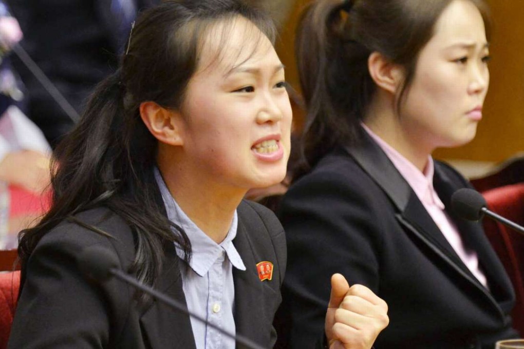 A colleague of 12 North Korean waitresses who defected to South Korea in April speaks at a news conference in Pyongyang on May 3, 2016. North Korea says the waitresses were abducted by South Korea from a restaurant in China while Seoul says they willingly defected to South Korea. Photo: Kyodo
