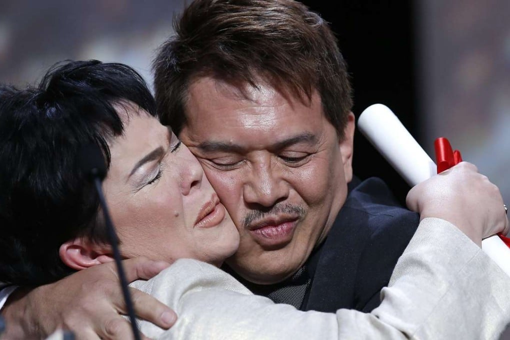 Philippine actress Jaclyn Jose hugs her director, Brillante Mendoza, after receiving the best actress award for her role in “Ma’ Rosa” at the 69th Cannes Film Festival, in Cannes on Sunday. Photo: EPA