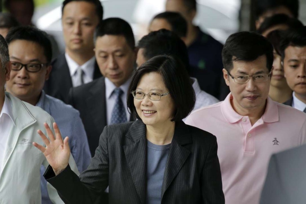 Taiwanese President Tsai Ing-wen (centre) waves to supporters as she arrives to vote for party officials on Sunday in Taipei. Photo: EPA