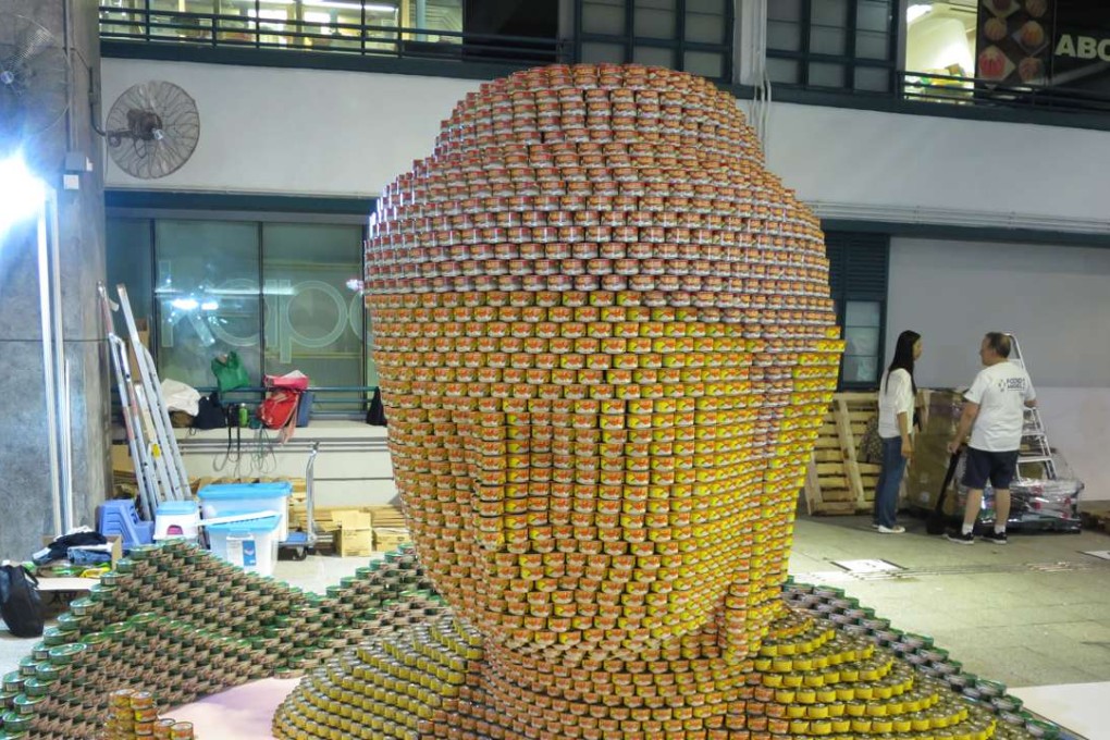 ‘Above the Clouds’ made up of 10,000 cans of seafood at the Hong Kong airport won the Founder’s Award in the Canstruction International Competition 2016. Photo: Hong Kong International Airport