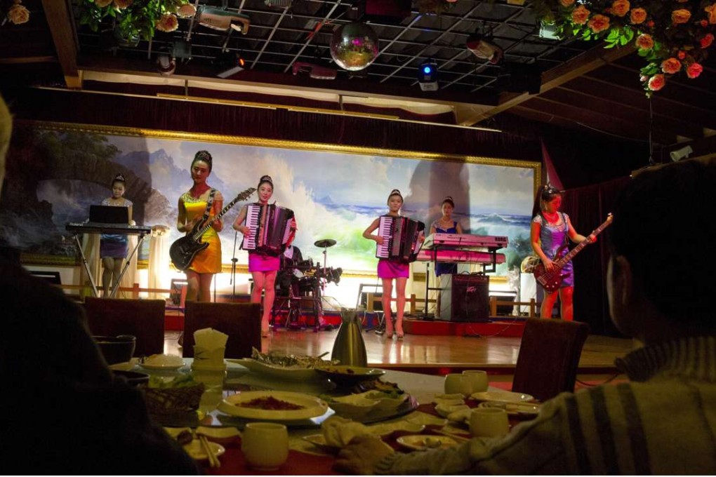 North Korean performers entertain customers at the Okryugwan restaurant in Beijing. Workers at a similar North Korean state-run restaurant in Xian are said to have defected to South Korea. Photo: AP