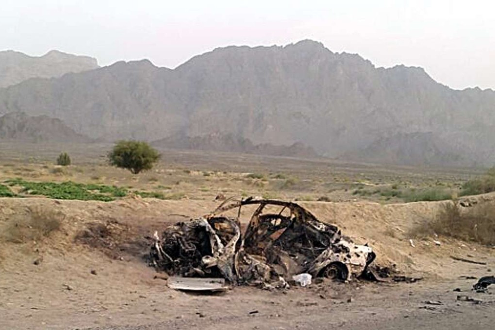 The destroyed vehicle in which Mullah Mohammad Akhtar Mansour was traveling in the Ahmad Wal area in Baluchistan province of Pakistan. Photo: AP