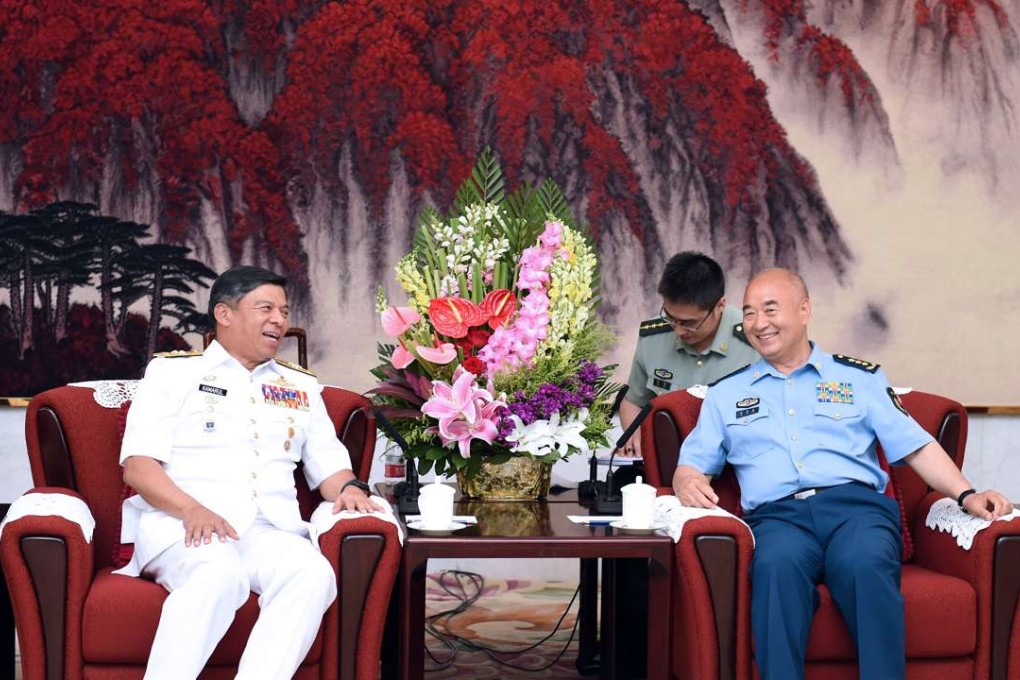 Xu Qiliang (right), vice-chairman of China's Central Military Commission, meets Malaysian Navy chief Admiral Dato’ Seri Panglima Ahmad Kamarulzaman bin Haji Ahmad Badaruddin in Beijing on Tuesday. Photo: Xinhua