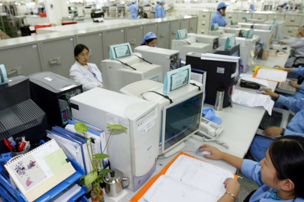 A file photograph of Chinese employees work in the office of Huawei Huawei Technologies Co.,Ltd in Shenzhen, south Chinas Guangdong province,