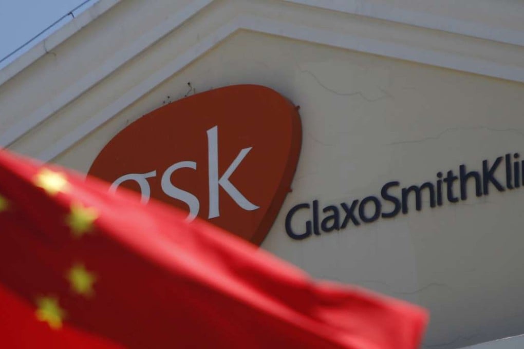 A Chinese national flag flies in front of a GlaxoSmithKline office building in Shanghai. GSK was fined a record 3 billion yuan for bribery in China in 2014. Photo: Reuters