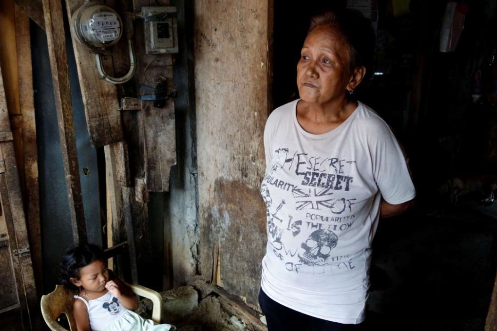 Clarita Alia, 62, stands at her home while talking about her four sons which have died in execution-style killings in Davao, Philippines May 14, 2016. Photo: Reuters