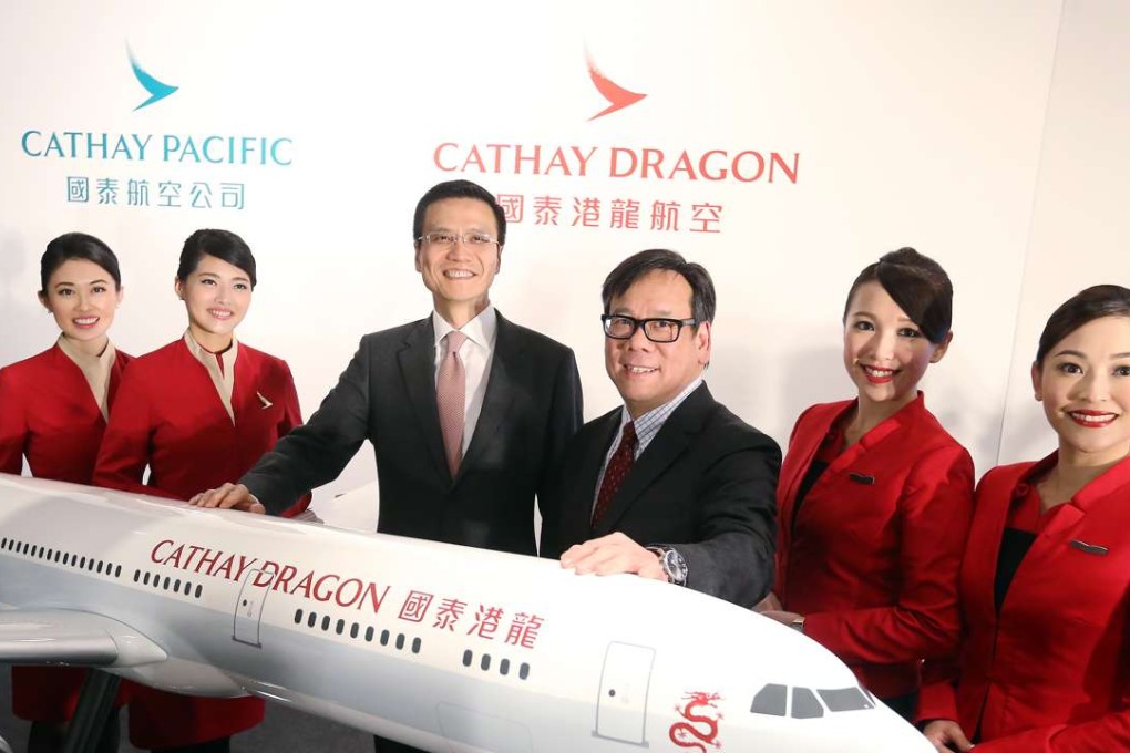 Cathay chief executive Ivan Chu (third from left) posed a picture with Algernon Yau (fourth from left) and other staff members at a press conference on Dragonair’s rebranding in January. Photo: Dickson Lee