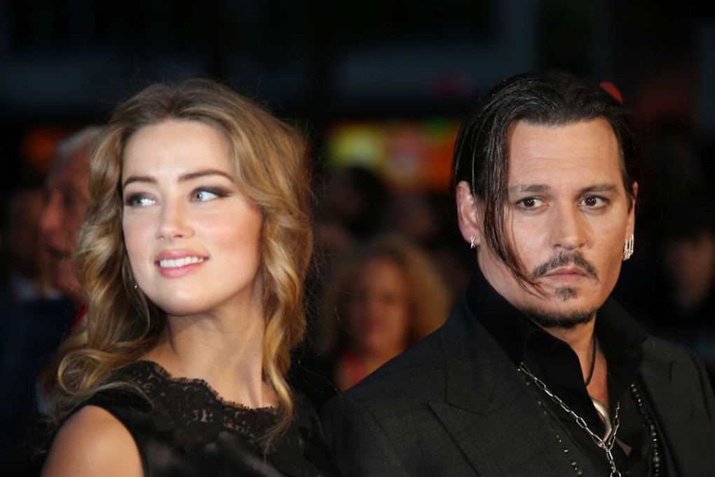 Amber Heard and Johnny Depp arrive at the premiere of Depp's film “Black Mass” last year. The couple filed for divorce in Los Angeles Superior Court on Monday. Photo: AP
