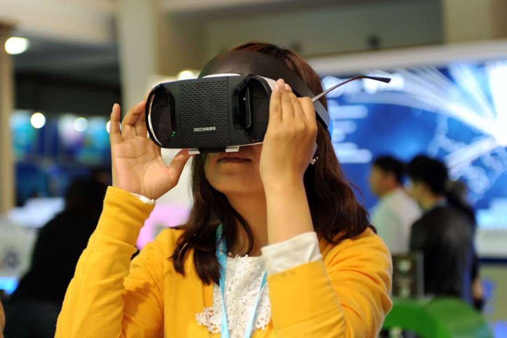 A woman experiences VR goggles at the 2016 Beijing Cyber Security Expo in Beijing in April. Photo: Xinhua