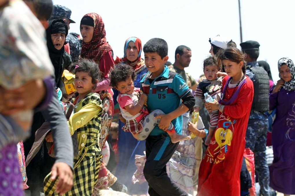 Iraqi families fleeing the city of Fallujah. Photo: AFP