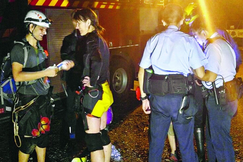 Two foreign abseilers were feared dead after being swept away by floods.