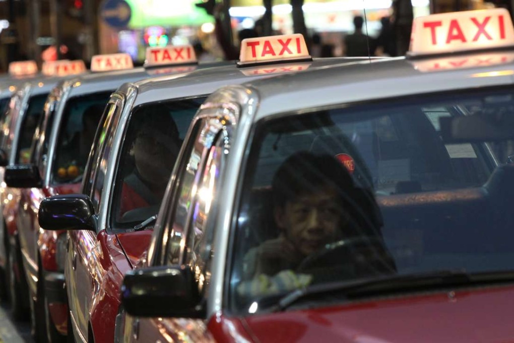 Taxi queue up to wait passenger at Causeway Bay. 06FEB11  SCMP/ May Tse
