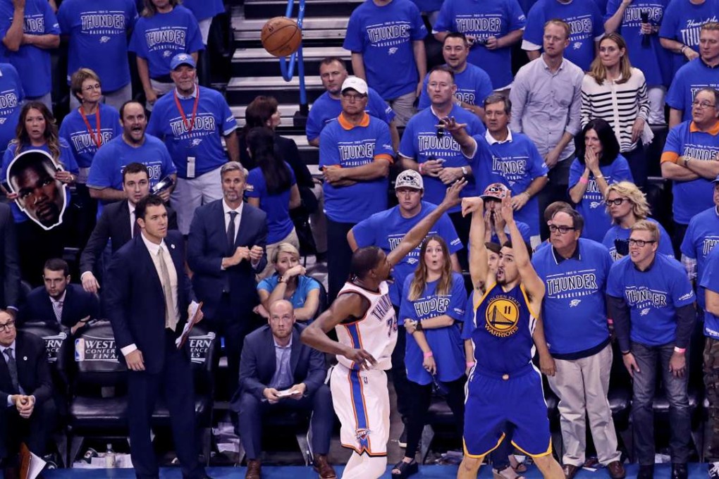 Golden State Warriors guard Klay Thompson scores over Oklahoma City Thunder during a scoring rampage that set the Warriors on the way to a clutch victory. Photo: USA Today