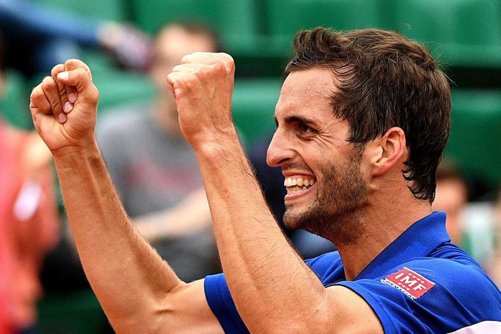 Albert Ramos-Vinolas celebrates beating Milos Raonic. Photo: EPA