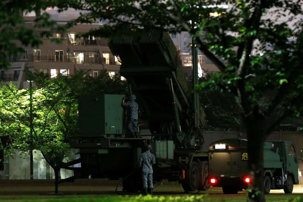 Japan Self-Defence Forces soldiers are seen near Patriot Advanced Capability-3 (PAC-3) missiles at the Defence Ministry in Tokyo, Japan, May 30, 2016. Photo: Reuters