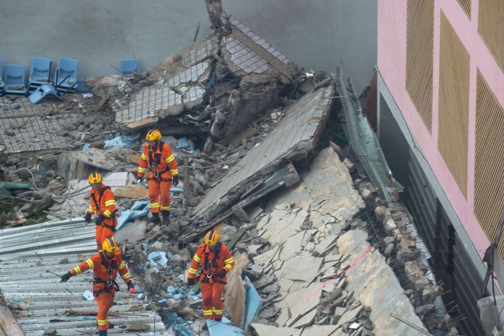 Firefighters search the debris of the collapsed rooftop of a sport centre in City University of Hong Kong in Hong Kong, China. Photo: EPA