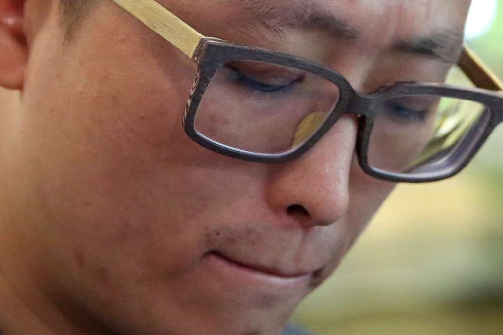 Brian Wang, son of the late 72-year-old Wang Keng-kao, appears at Hong Kong Academy of Medicine in Aberdeen. Three nurses who bandaged Wang Keng-kao's breathing hole in the neck with gauze by mistake in 2011, were on Monday found guilty of professional misconduct. Photo: Sam Tsang