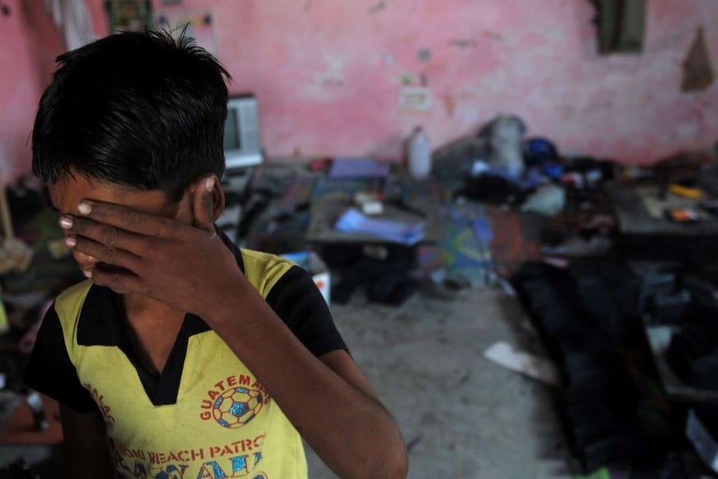 Aan Indian bonded child labourer crying during a raid and rescue operation conducted by the Bachpan Bachao Andolan (Save the Childhood Movement) in New Delhi. More than 45 million men, women and children globally are trapped in modern slavery, far more than previously thought, with two-thirds in the Asia-Pacific, a study showed May 31, 2016. Photo: AFP