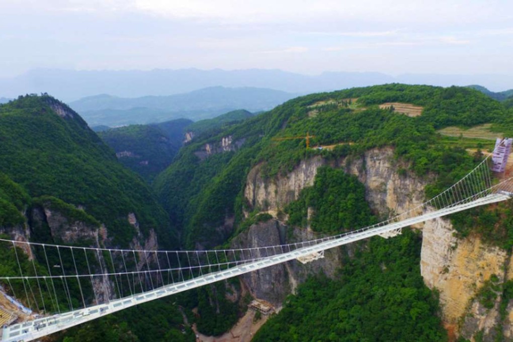 Construction for the world’s longest and highest glass-bottomed bridge above the Zhangjiajie Grand Canyon in central China’s Hunan province is completed. Photo: SCMP Pictures