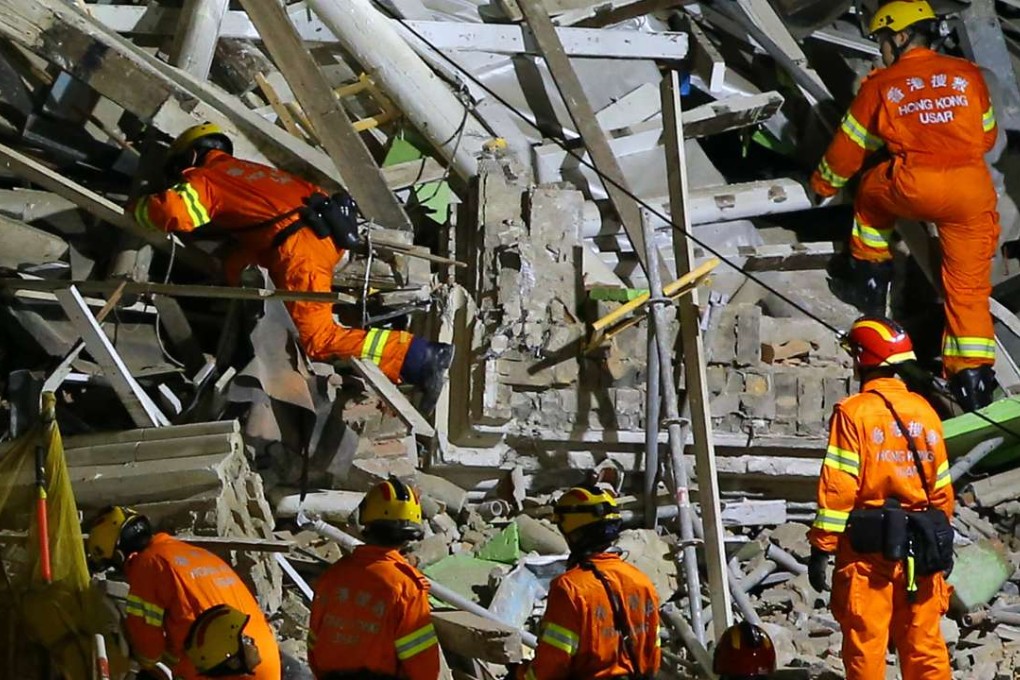 Workers sift through the rubble at the Central Police Station compound. Photo: SCMP Pictures