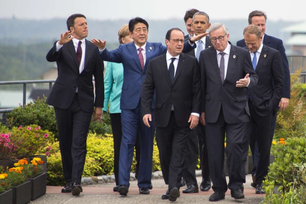 (From the left) Italian Prime Minister Matteo Renzi, German Chancellor Angela Merkel, Japanese Prime Minister Shinzo Abe, French President Francois Hollande, Canadian Prime Minister Justin Trudeau, US President Barack Obama, European Commission President Jean-Claude Juncker, European Council President Donald Tusk and British Prime Minister David Cameron walk to a photo op during the first day of the G7 summit. Photo: AP