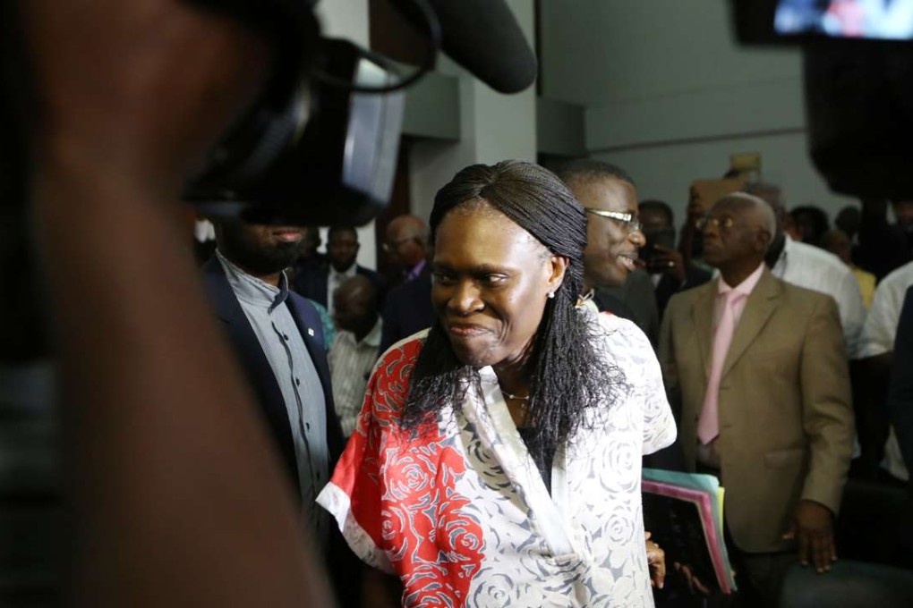 Ivory Coast's former first lady Simone Gbagbo, who is accused of crimes against humanity and war crimes, arrives at a court in Abidjan on Tuesday. Photo: Reuters